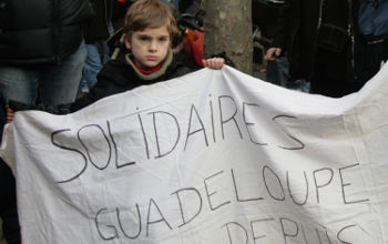 The action in Guadeloupe has also to be seen in the wider context of mobilisations all over France against the Sarkozy government. Here one of the French protesters is showing his solidarity with Guadeloupe. Photo by Carole Kerbage on Flickr.