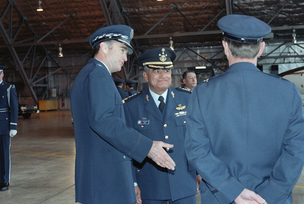 Lieutenant General (LGEN) Miguel Mendoza of the Mexican Air Force (center) is greeted upon his arrival by Air Force Chief of Staff General (GEN) Charles Gabriel (left) and Brigadier General (BGEN) Albert Guidotti, commander, 76th Airlift Division, Military Airlift Command (right).