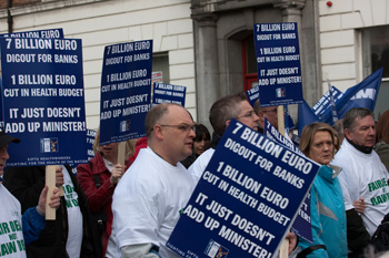 Demonstrators march in defence of conditions in Dublin. Photo by informatique on Flickr.