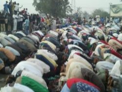 Muslims praying in Kano, whilst Christians keep watch, 6 January.