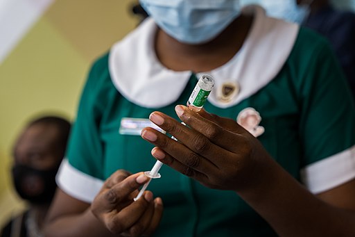 On 2 March 2021, a nurse prepares to administer a dose of the AstraZeneca/Oxford COVID-19 vaccine at Accra's Ridge Hospital, as Ghana rolls out its national COVID-19 vaccination campaign. Health workers, seniors and people with underlying conditions are prioritized for vaccination...As the global rollout of COVAX vaccines accelerates, the first COVID-19 vaccination campaigns in the African Region using COVAX doses began 1 March 2021 in Ghana and Côte D'Ivoire. These campaigns are the among the first to use doses provided by COVAX. This is an historic step towards ensuring equitable distribution of COVID-19 vaccines worldwide. ..COVAX, the vaccines pillar of the Access to COVID-19 Tools (ACT) Accelerator, is co-led by the Coalition for Epidemic Preparedness Innovations (CEPI), Gavi, the Vaccine Alliance and WHO working in partnership with developed and developing country vaccine manufacturers, UNICEF, the World Bank, and others. It is the only global initiative that is working with governments and manufacturers to ensure COVID-19 vaccines are available worldwide to both higher-income and lower-income countries.